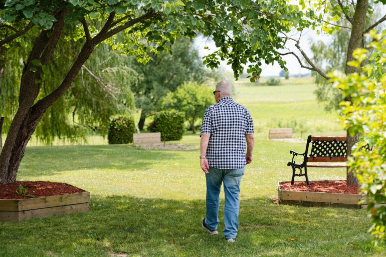 Man walking through trees