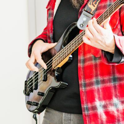 OMC - client playing bass guitar