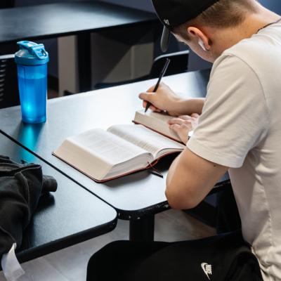ATMC - client reading and working at desk