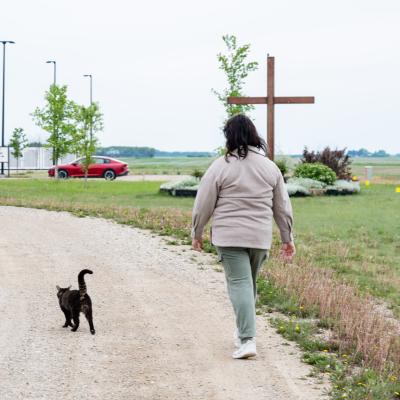 PHWC - client walking outside with cat following