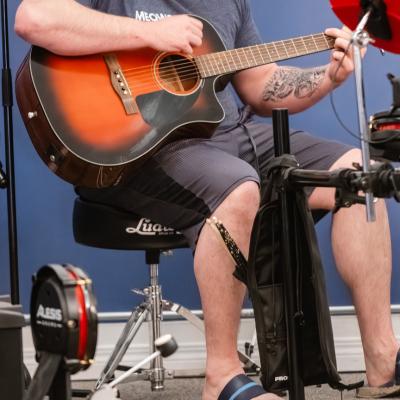 SKMC playing guitar