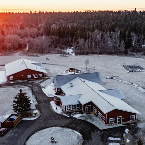 Alberta Men's Centre birds eye view of buildings with sun rising behind