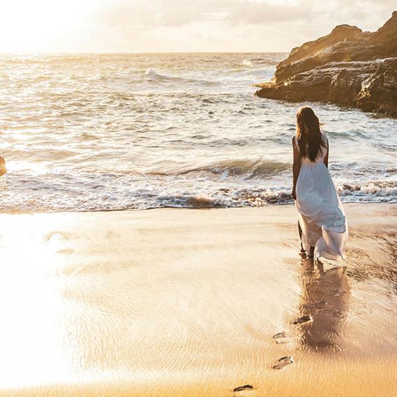 Woman walking on beach